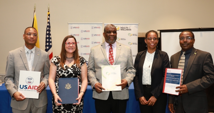 An image of government officials from Jamaica. As part of a One Health launch event officials gather to showcase progress.