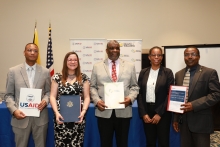 An image of government officials from Jamaica. As part of a One Health launch event officials gather to showcase progress.