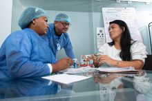 Image of a patient and two health care providers in Colombia